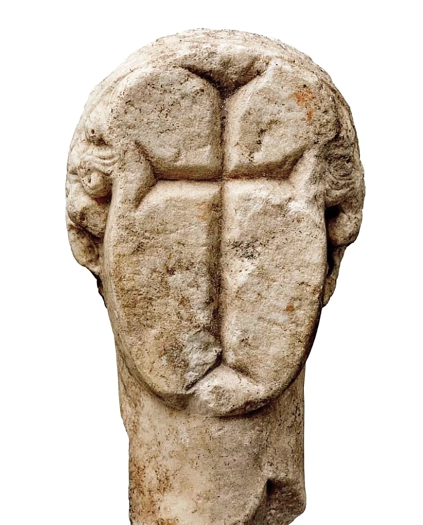An ancient marble head of a classical goddess, defaced and carved with a Christian cross around the year 500 AD, Archaeological Museum of Samos.
