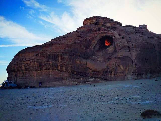 Dragon Head Mountain, located in South Sinai, Egypt 🇪🇬, a striking natural formation that resembles a colossal dragon's head emerging from the rugged landscape. Its most intriguing feature is the 'eye'—a deep cave that often flickers with a mysterious red glow, which, upon closer inspection, is revealed to be the light of a campfire inside. This eerie yet captivating sight has inspired legends and adds a mystical allure to the already breathtaking desert surroundings.#archaeohistories